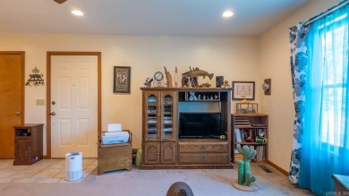 This well-cared-for 3-bedroom, 3-bath home offers comfort and on Cherokee Village North Course in Arkansas - for sale on GolfHomes.com, golf home, golf lot