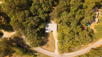 This well-cared-for 3-bedroom, 3-bath home offers comfort and on Cherokee Village North Course in Arkansas - for sale on GolfHomes.com, golf home, golf lot