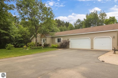 This freshly remodeled three bedroom, 2 bath home sits on almost on Interlochen Golf and Country Club in Michigan - for sale on GolfHomes.com, golf home, golf lot