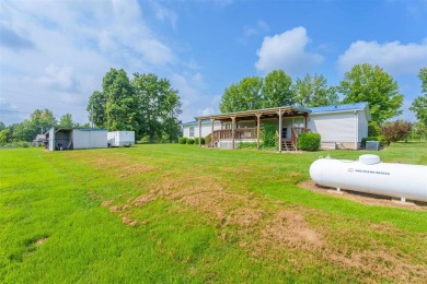 This stunning 3-bedroom, 2-bathroom double-wide home sits on a 2 on Panther Creek Golf Course in Kentucky - for sale on GolfHomes.com, golf home, golf lot