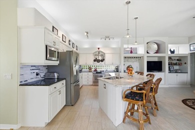 Beautifully updated 1994 Palmwood Bahama Breeze courtyard pool on Glen Lakes Country Club in Florida - for sale on GolfHomes.com, golf home, golf lot