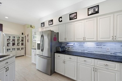 Beautifully updated 1994 Palmwood Bahama Breeze courtyard pool on Glen Lakes Country Club in Florida - for sale on GolfHomes.com, golf home, golf lot