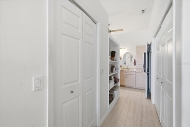 Beautifully updated 1994 Palmwood Bahama Breeze courtyard pool on Glen Lakes Country Club in Florida - for sale on GolfHomes.com, golf home, golf lot