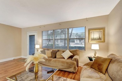 Bright first floor condo in Wynmoor, a gated 55 plus community on Wynmoor Golf Course in Florida - for sale on GolfHomes.com, golf home, golf lot