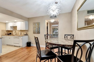 Bright first floor condo in Wynmoor, a gated 55 plus community on Wynmoor Golf Course in Florida - for sale on GolfHomes.com, golf home, golf lot