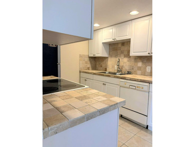 Bright first floor condo in Wynmoor, a gated 55 plus community on Wynmoor Golf Course in Florida - for sale on GolfHomes.com, golf home, golf lot