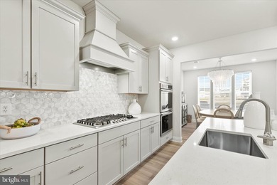 Welcome to 24321 Blue Crab Ave, a three-year-young town home on The Peninsula Golf and Country Club in Delaware - for sale on GolfHomes.com, golf home, golf lot