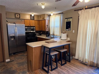 Welcome to Raintree Village Condominiums!  This 2-bedroom, 1 on Raintree Country Club in Missouri - for sale on GolfHomes.com, golf home, golf lot