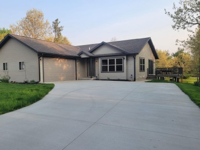 Stately ranch home on the 13th fairway of the Pines Golf Course on Lake Arrowhead Golf Course - The Pines in Wisconsin - for sale on GolfHomes.com, golf home, golf lot