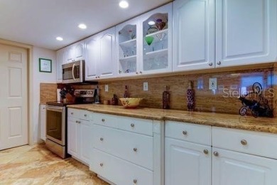 Embrace the epitome of Coastal Living on the 8th floor of this on Isla Del Sol Yacht and Country Club in Florida - for sale on GolfHomes.com, golf home, golf lot