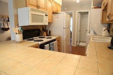 Desirable first floor, 1 BR, 1 BA Driftwood Villa overlooking on The Plantation Course At Edisto in South Carolina - for sale on GolfHomes.com, golf home, golf lot