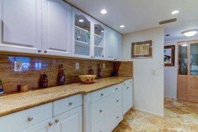 Embrace the epitome of Coastal Living on the 8th floor of this on Isla Del Sol Yacht and Country Club in Florida - for sale on GolfHomes.com, golf home, golf lot