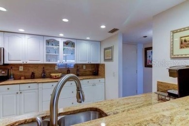 Embrace the epitome of Coastal Living on the 8th floor of this on Isla Del Sol Yacht and Country Club in Florida - for sale on GolfHomes.com, golf home, golf lot