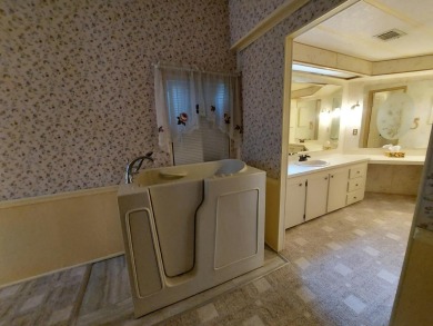 This lovely larger home has had a full roof replacement and All on Lakes at Leesburg Golf Course in Florida - for sale on GolfHomes.com, golf home, golf lot