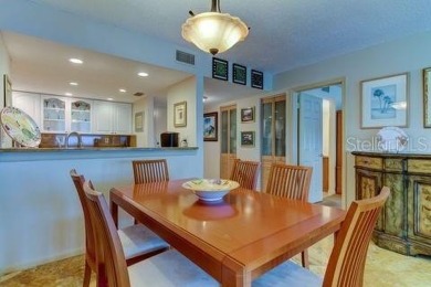 Embrace the epitome of Coastal Living on the 8th floor of this on Isla Del Sol Yacht and Country Club in Florida - for sale on GolfHomes.com, golf home, golf lot