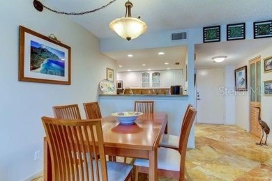 Embrace the epitome of Coastal Living on the 8th floor of this on Isla Del Sol Yacht and Country Club in Florida - for sale on GolfHomes.com, golf home, golf lot