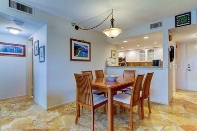 Embrace the epitome of Coastal Living on the 8th floor of this on Isla Del Sol Yacht and Country Club in Florida - for sale on GolfHomes.com, golf home, golf lot