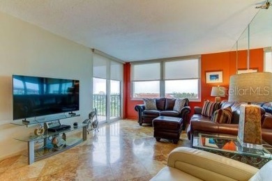 Embrace the epitome of Coastal Living on the 8th floor of this on Isla Del Sol Yacht and Country Club in Florida - for sale on GolfHomes.com, golf home, golf lot