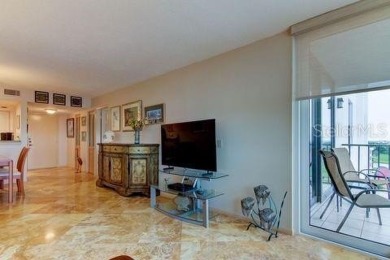 Embrace the epitome of Coastal Living on the 8th floor of this on Isla Del Sol Yacht and Country Club in Florida - for sale on GolfHomes.com, golf home, golf lot