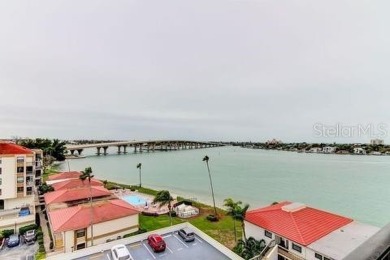 Embrace the epitome of Coastal Living on the 8th floor of this on Isla Del Sol Yacht and Country Club in Florida - for sale on GolfHomes.com, golf home, golf lot