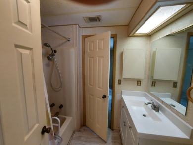 This lovely larger home has had a full roof replacement and All on Lakes at Leesburg Golf Course in Florida - for sale on GolfHomes.com, golf home, golf lot