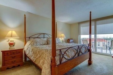Embrace the epitome of Coastal Living on the 8th floor of this on Isla Del Sol Yacht and Country Club in Florida - for sale on GolfHomes.com, golf home, golf lot
