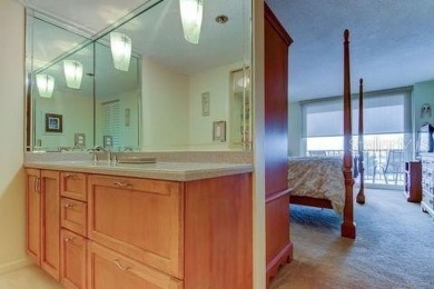 Embrace the epitome of Coastal Living on the 8th floor of this on Isla Del Sol Yacht and Country Club in Florida - for sale on GolfHomes.com, golf home, golf lot