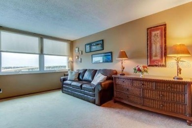 Embrace the epitome of Coastal Living on the 8th floor of this on Isla Del Sol Yacht and Country Club in Florida - for sale on GolfHomes.com, golf home, golf lot
