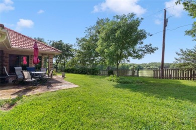Spanish-style charm shines in this beautiful home set on an on Hillsboro Country Club in Texas - for sale on GolfHomes.com, golf home, golf lot