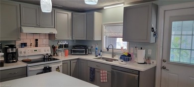 Move in Ready, Many upgrades, long canal view with sunset views on Pelicans Nest Golf Club in Florida - for sale on GolfHomes.com, golf home, golf lot