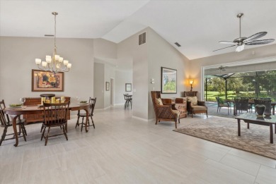 Enjoy stunning lake and golf course views framed by mature trees on Waterford Golf Club in Florida - for sale on GolfHomes.com, golf home, golf lot