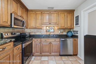 Welcome to your laid-back slice of coastal paradise, nestled on Spessard Holland Golf Course in Florida - for sale on GolfHomes.com, golf home, golf lot