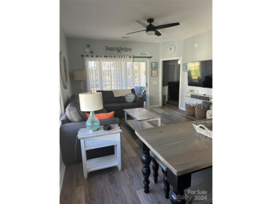 This beautifully updated third-floor condo is located in the on Sea Trail Golf Resort in North Carolina - for sale on GolfHomes.com, golf home, golf lot