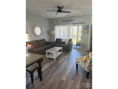 This beautifully updated third-floor condo is located in the on Sea Trail Golf Resort in North Carolina - for sale on GolfHomes.com, golf home, golf lot