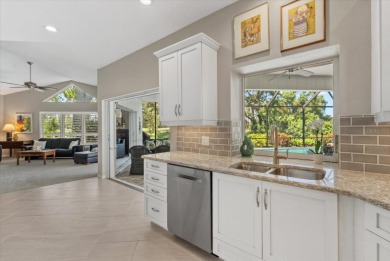 Enjoy stunning lake and golf course views framed by mature trees on Waterford Golf Club in Florida - for sale on GolfHomes.com, golf home, golf lot