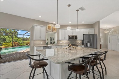 Enjoy stunning lake and golf course views framed by mature trees on Waterford Golf Club in Florida - for sale on GolfHomes.com, golf home, golf lot