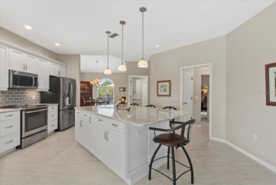 Enjoy stunning lake and golf course views framed by mature trees on Waterford Golf Club in Florida - for sale on GolfHomes.com, golf home, golf lot