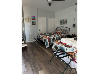 This beautifully updated third-floor condo is located in the on Sea Trail Golf Resort in North Carolina - for sale on GolfHomes.com, golf home, golf lot