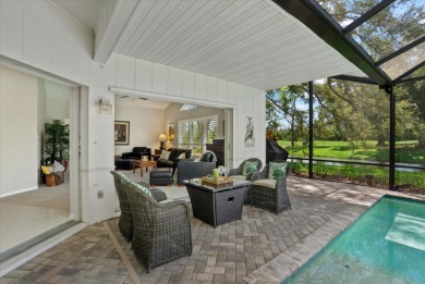 Enjoy stunning lake and golf course views framed by mature trees on Waterford Golf Club in Florida - for sale on GolfHomes.com, golf home, golf lot