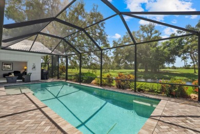 Enjoy stunning lake and golf course views framed by mature trees on Waterford Golf Club in Florida - for sale on GolfHomes.com, golf home, golf lot