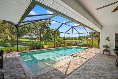Enjoy stunning lake and golf course views framed by mature trees on Waterford Golf Club in Florida - for sale on GolfHomes.com, golf home, golf lot