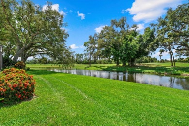 Enjoy stunning lake and golf course views framed by mature trees on Waterford Golf Club in Florida - for sale on GolfHomes.com, golf home, golf lot