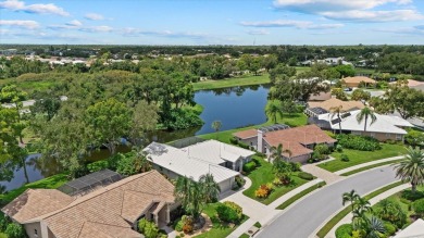 Enjoy stunning lake and golf course views framed by mature trees on Waterford Golf Club in Florida - for sale on GolfHomes.com, golf home, golf lot
