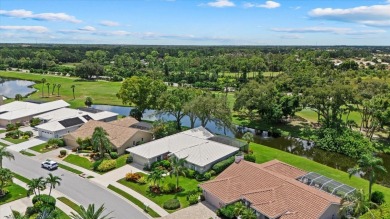 Enjoy stunning lake and golf course views framed by mature trees on Waterford Golf Club in Florida - for sale on GolfHomes.com, golf home, golf lot