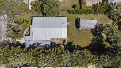 Welcome to your laid-back slice of coastal paradise, nestled on Spessard Holland Golf Course in Florida - for sale on GolfHomes.com, golf home, golf lot