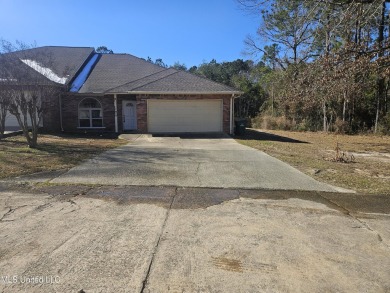 Beautifully half of a duplex located in the sought-after on Diamondhead Country Club in Mississippi - for sale on GolfHomes.com, golf home, golf lot