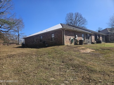 Beautifully half of a duplex located in the sought-after on Diamondhead Country Club in Mississippi - for sale on GolfHomes.com, golf home, golf lot