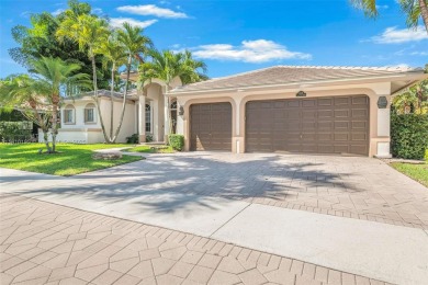 Luxury living awaits in this stunning one-story pool home on the on Weston Hills Country Club in Florida - for sale on GolfHomes.com, golf home, golf lot