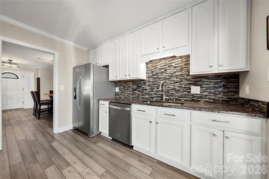 Welcome to 8615 Golf Ridge Drive, an updated ranch-style home on Raintree Country Club in North Carolina - for sale on GolfHomes.com, golf home, golf lot