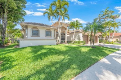 Luxury living awaits in this stunning one-story pool home on the on Weston Hills Country Club in Florida - for sale on GolfHomes.com, golf home, golf lot